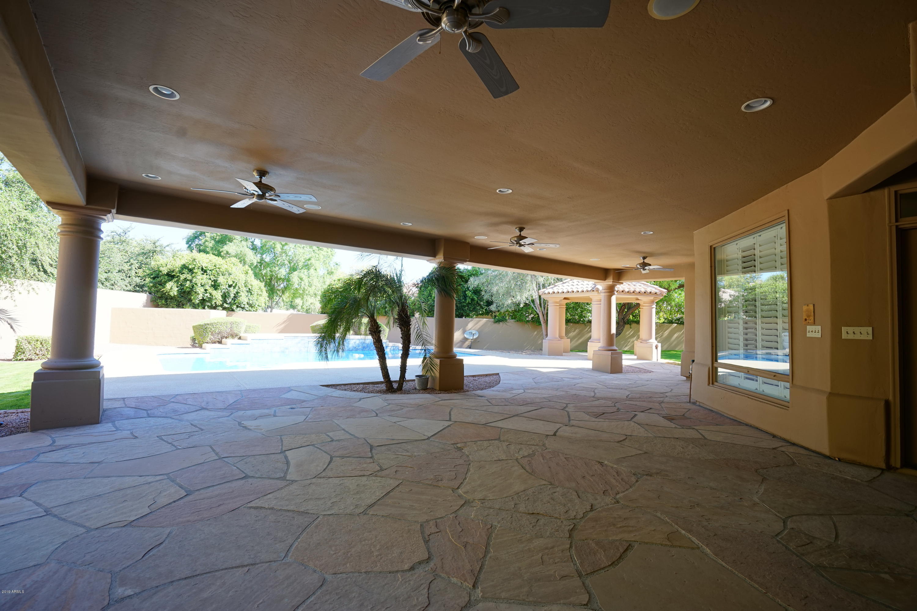 1225 East Warner Road, Unit 6 Tempe, AZ 85284 - Photo 62 of 86 a view of a porch with a floor to ceiling window and a big room