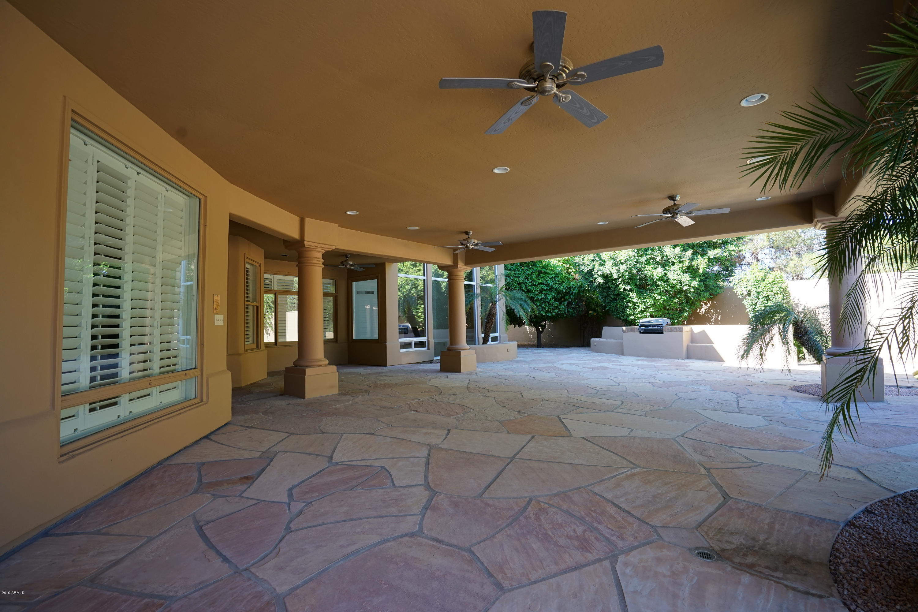 1225 East Warner Road, Unit 6 Tempe, AZ 85284 - Photo 63 of 86 a view of a building with a ceiling fan and a porch