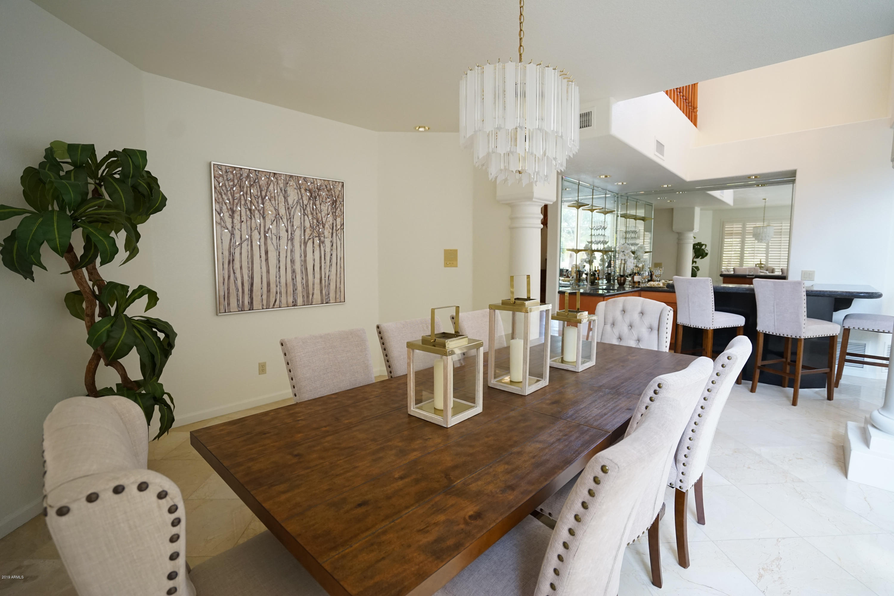 1225 East Warner Road, Unit 6 Tempe, AZ 85284 - Photo 8 of 86 a view of a dining room with furniture a chandelier and wooden floor