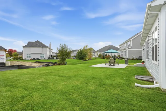 a view of swimming pool with a yard