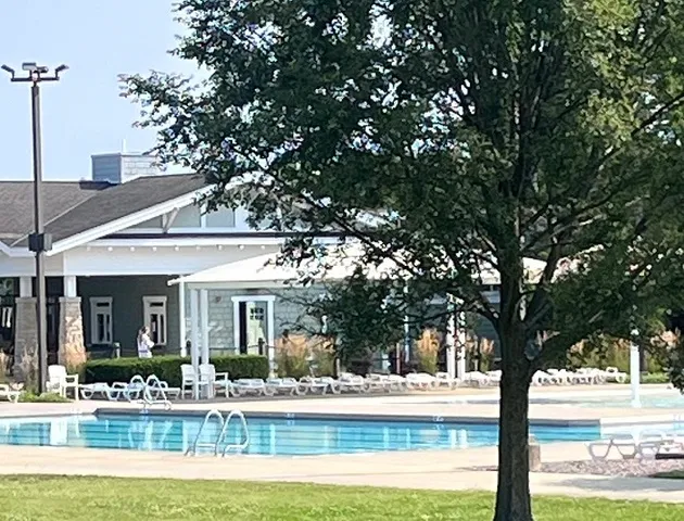 a view of a house with backyard porch and sitting area