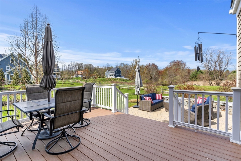 4 Point Shore Overlook Amesbury, MA 01913 - Photo 33 of 42 a view of a balcony with furniture and wooden floor