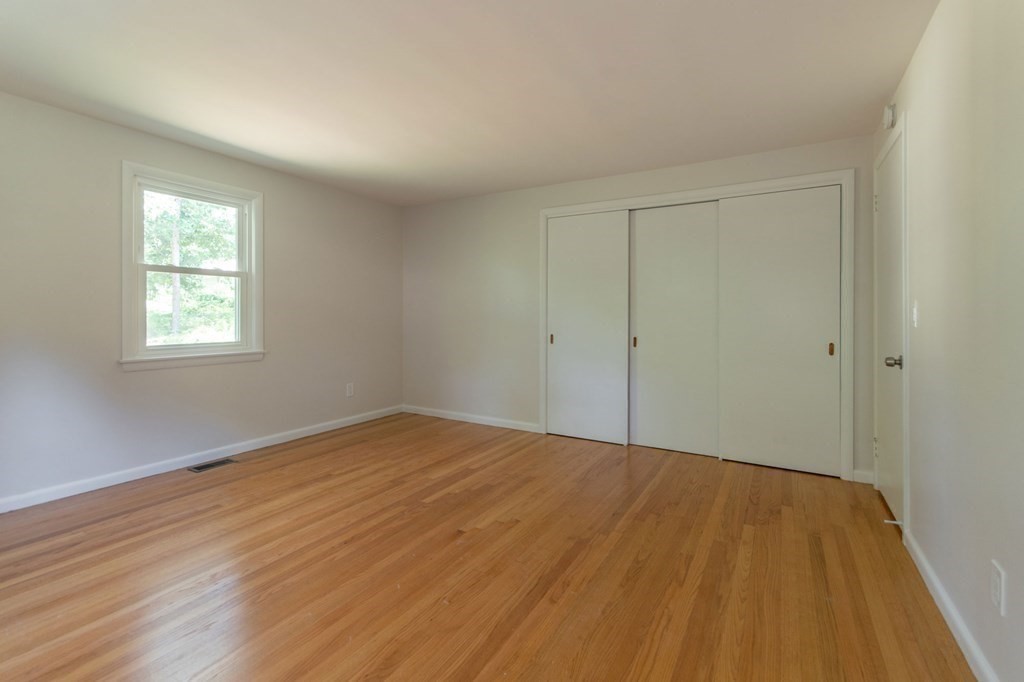 19 Robin Road Longmeadow, MA 01106 - Photo 31 of 39 a view of empty room with wooden floor and fan