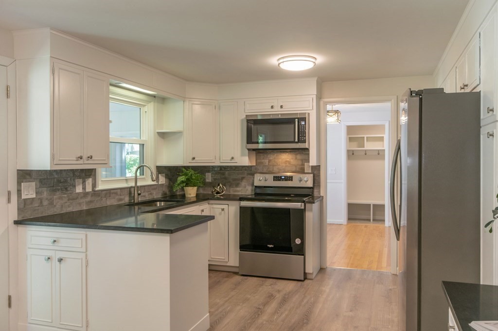 19 Robin Road Longmeadow, MA 01106 - Photo 6 of 39 a kitchen with a refrigerator stove and sink