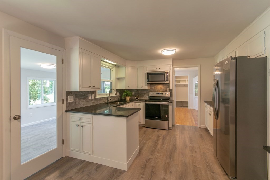 19 Robin Road Longmeadow, MA 01106 - Photo 8 of 39 a kitchen with stainless steel appliances a sink stove and refrigerator