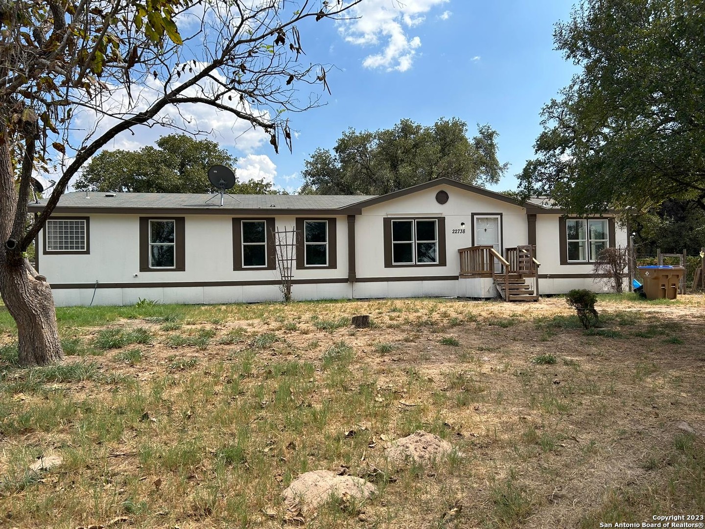 a front view of a house with yard