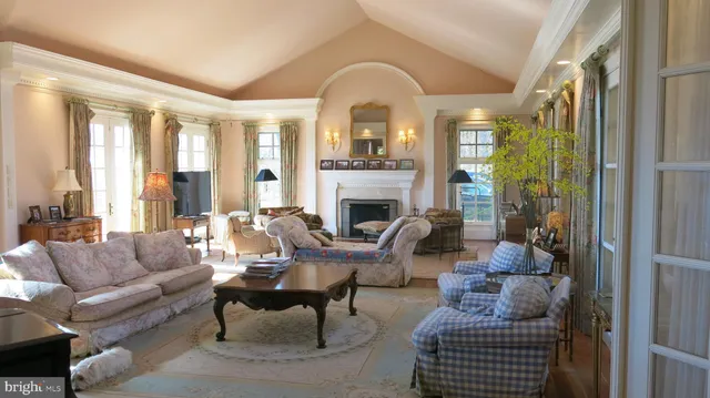 a view of a livingroom with furniture window and wooden floor