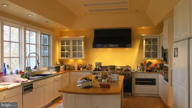a view of a dining room with a table and chairs