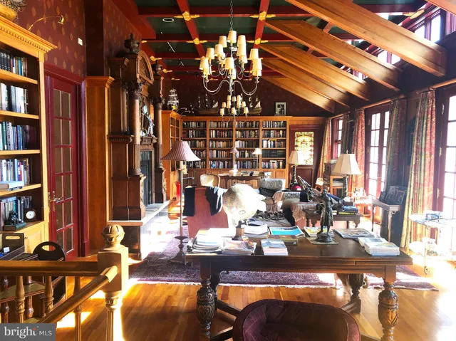 a outdoor dining space with furniture and a book shelf