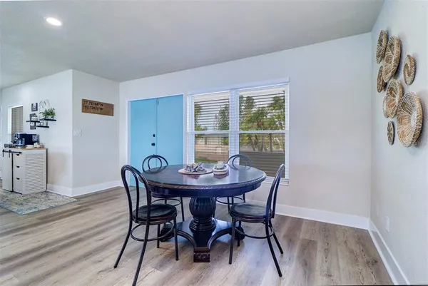 a view of a dining room with furniture and window