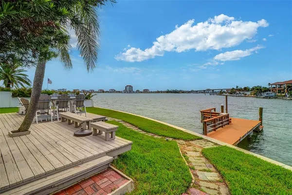 a view of a lake with chairs