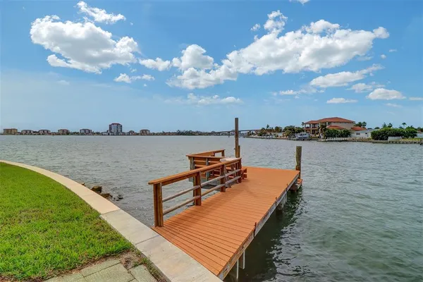 a view of a lake with outdoor seating