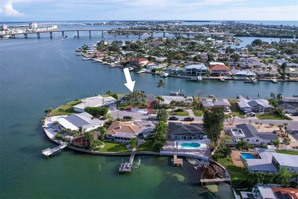 an aerial view of a house with a lake view