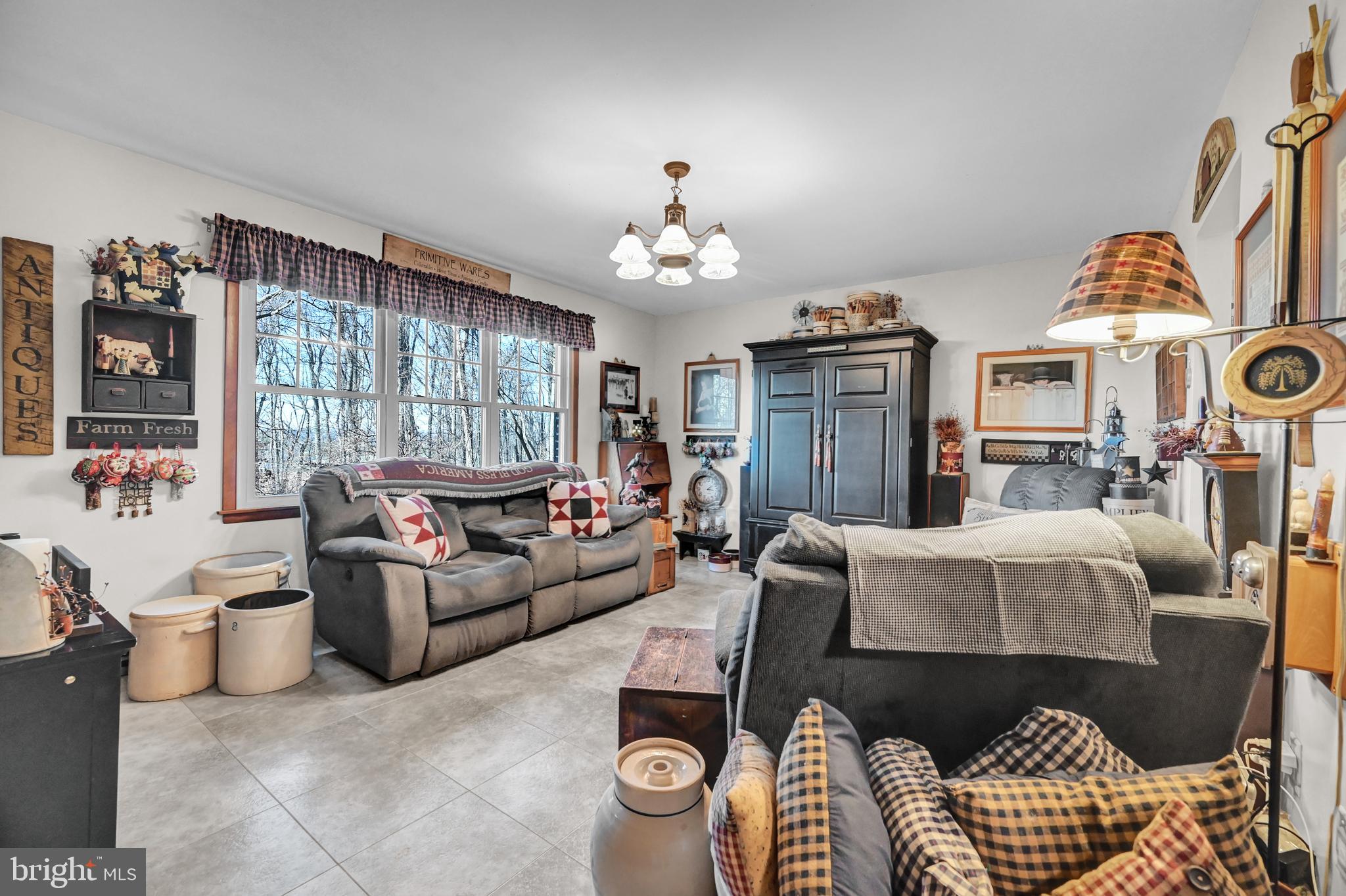 2697 Stoverstown Road Spring Grove, PA 17362 - Photo 6 of 38 a living room with furniture and a chandelier