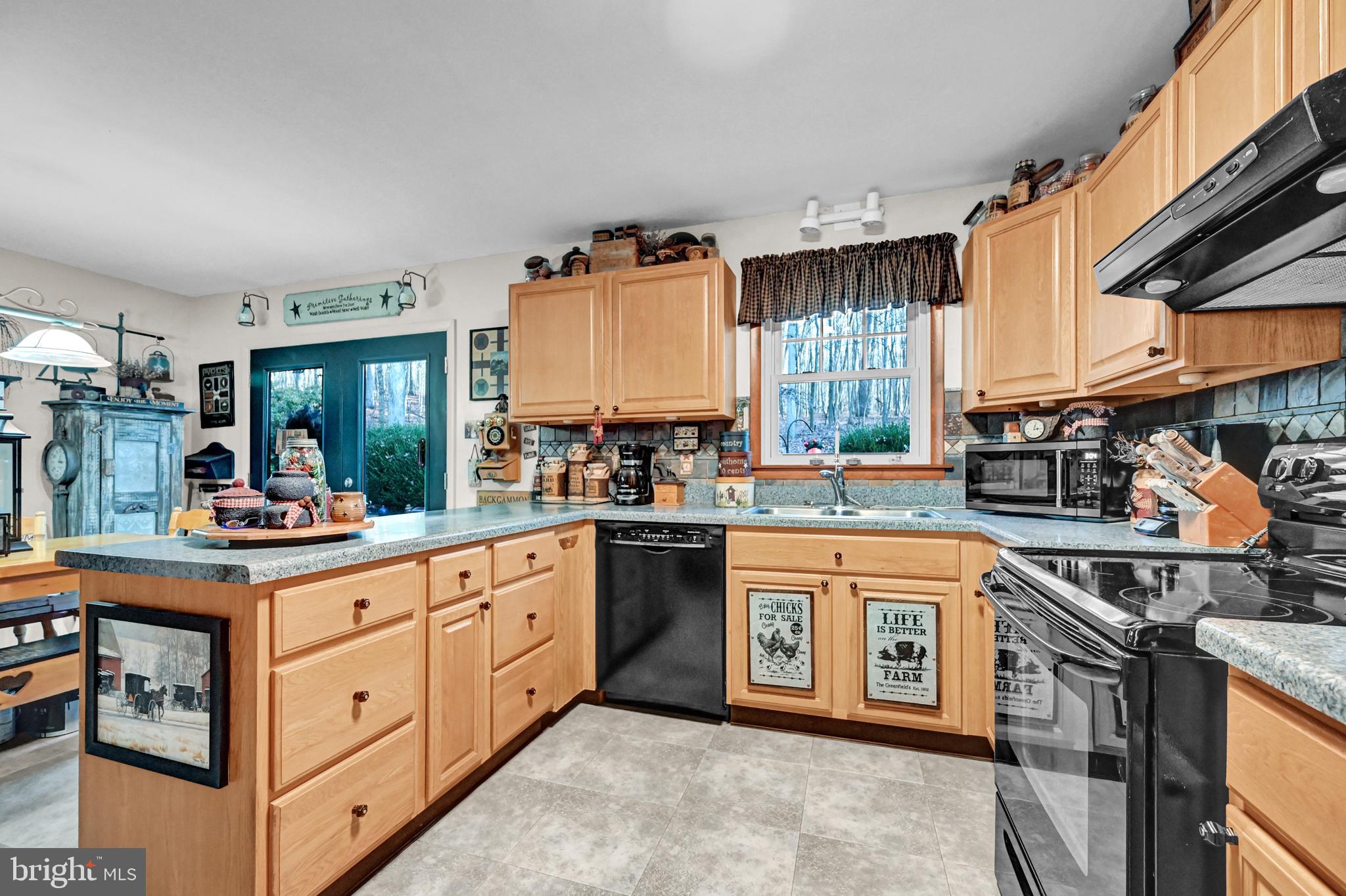 2697 Stoverstown Road Spring Grove, PA 17362 - Photo 7 of 38 a kitchen with stainless steel appliances granite countertop a stove a sink dishwasher and cabinets with wooden floor