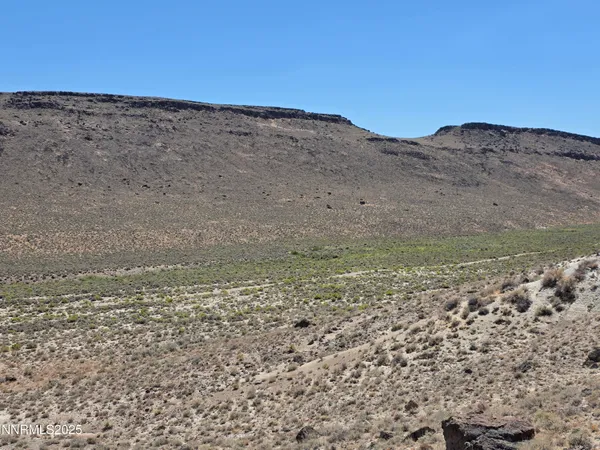 a view of ocean and mountains