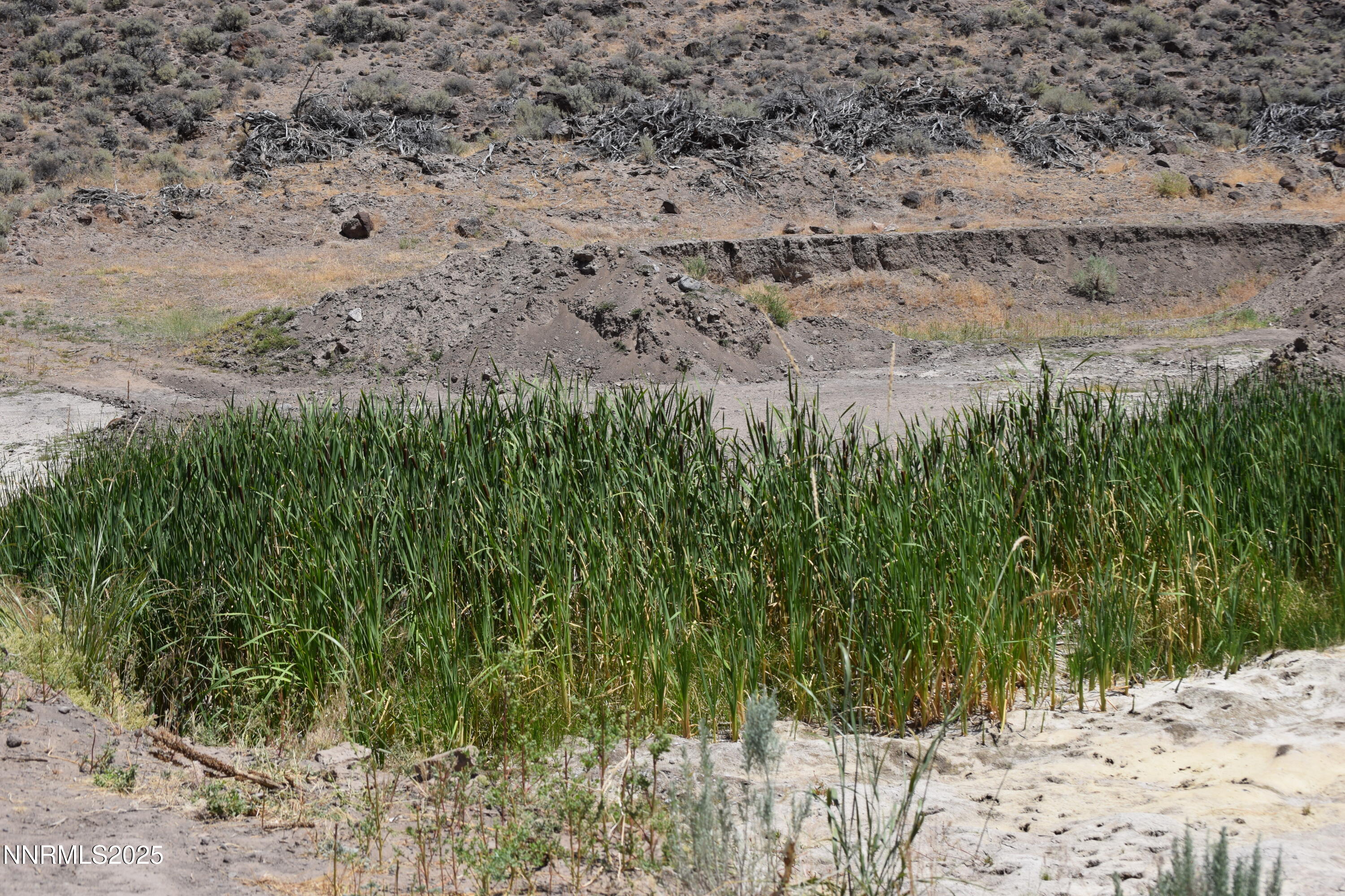 3304 High Rock Road, Unit HIGH ROCK ROAD APPROX 4 2 MILES Reno, NV 89510 - Photo 42 of 49 a view of a road with a yard