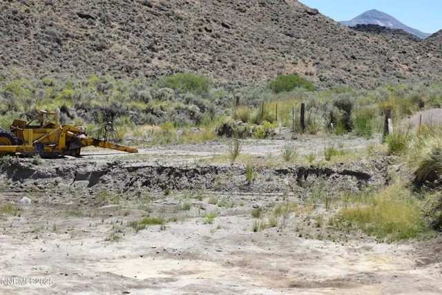 a view of a lake with mountain and trees