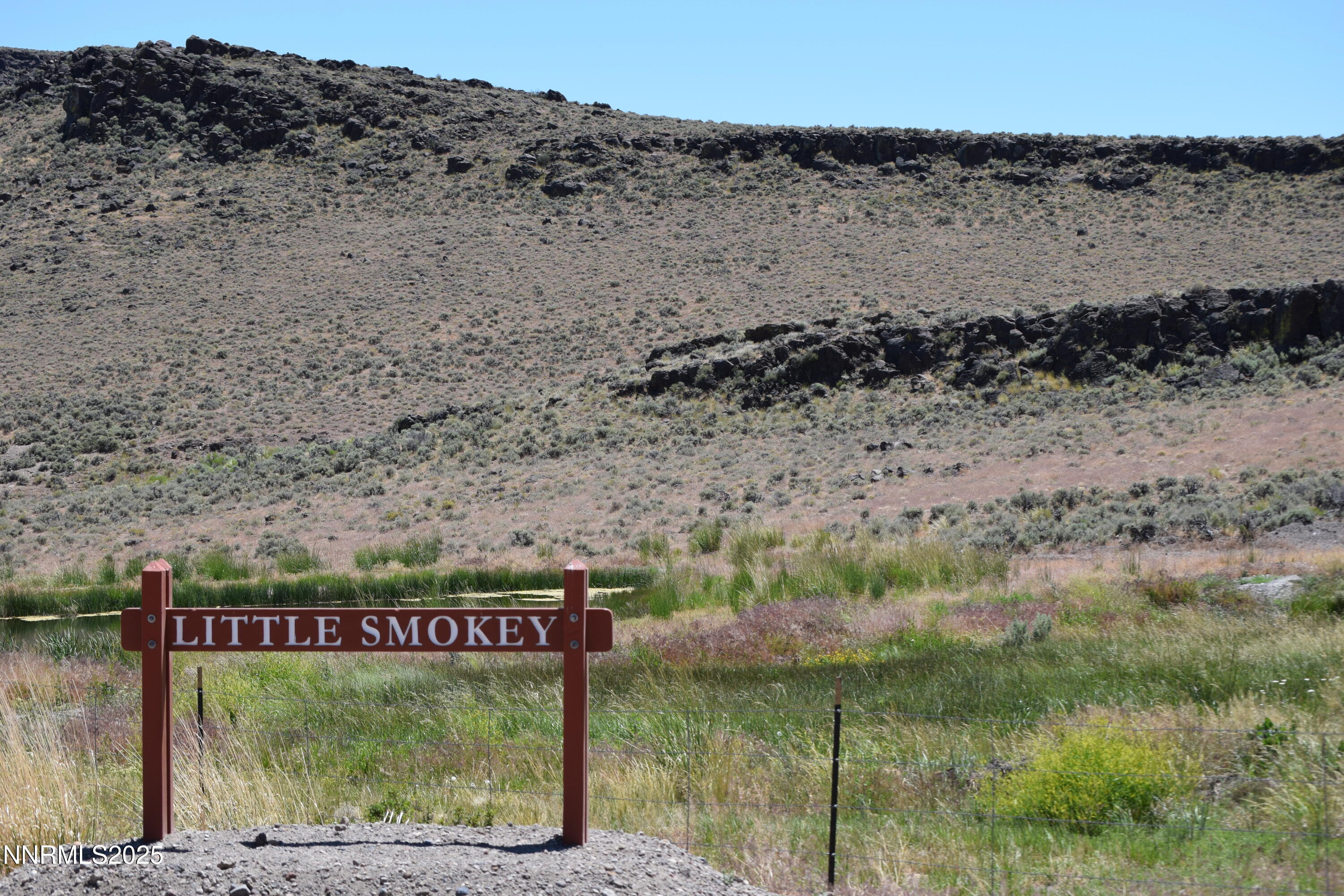 3304 High Rock Road, Unit HIGH ROCK ROAD APPROX 4 2 MILES Reno, NV 89510 - Photo 5 of 49 a sign on the side of a road