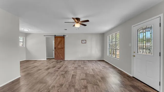 a view of an empty room with a window