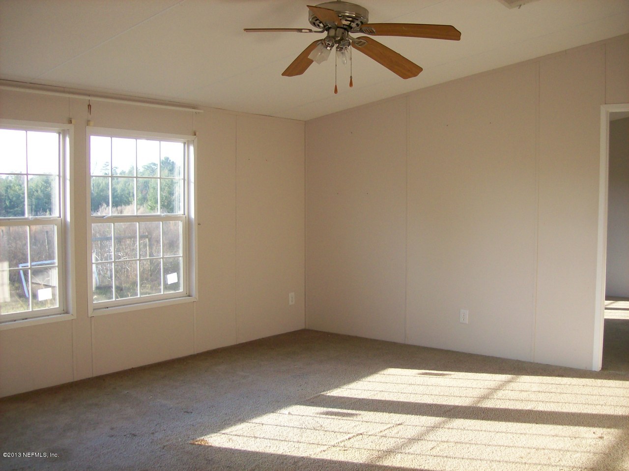302 Beecher Springs Road Welaka, FL 32112 - Photo 3 of 29 a view of an empty room with a window