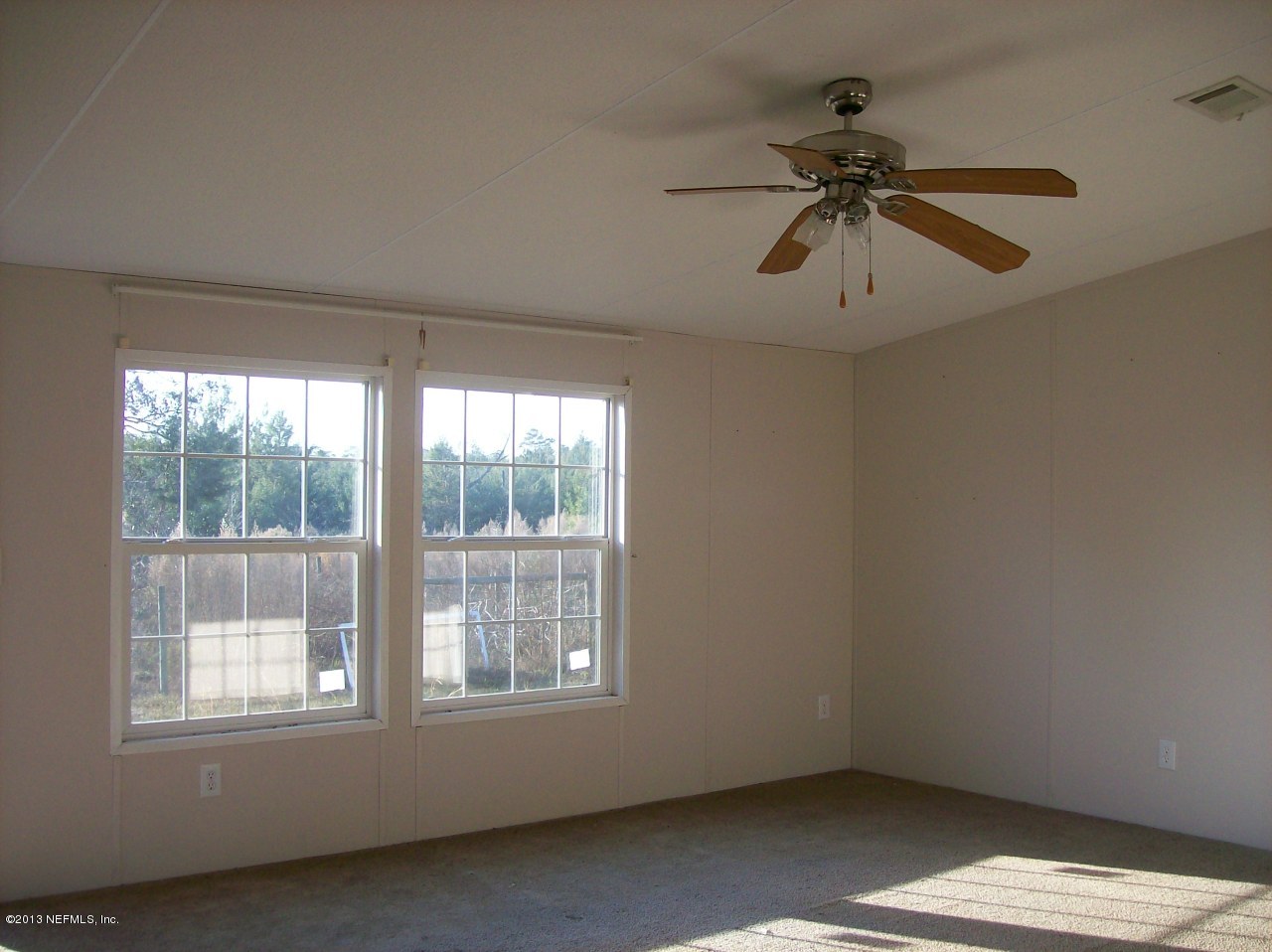 302 Beecher Springs Road Welaka, FL 32112 - Photo 4 of 29 a view of an empty room and window