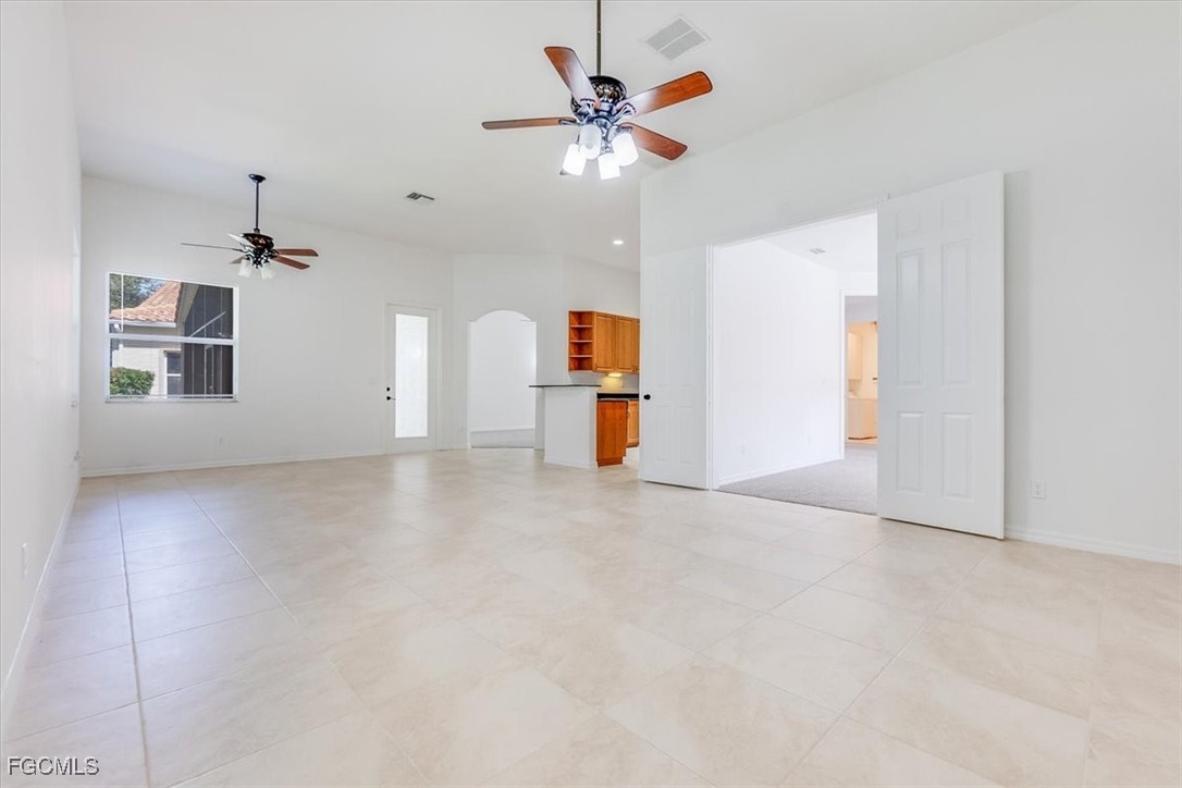 20340 Foxworth Circle Estero, FL 33928 - Photo 15 of 39 wooden floor in an empty room with a window