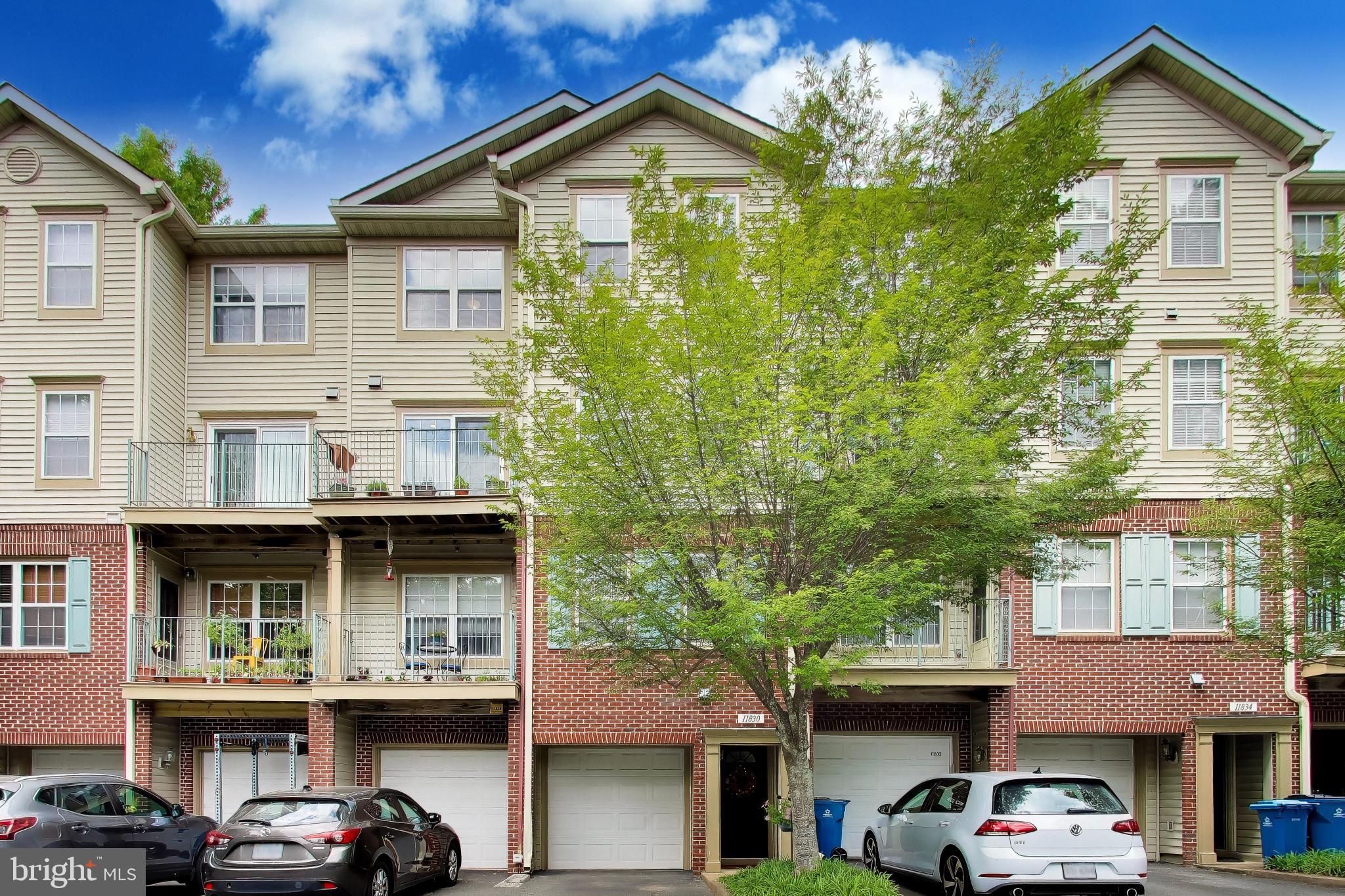 11830 Breton Court, Unit 23B Reston, VA 20191 - Photo 2 of 43 Charming townhouse with lush greenery.