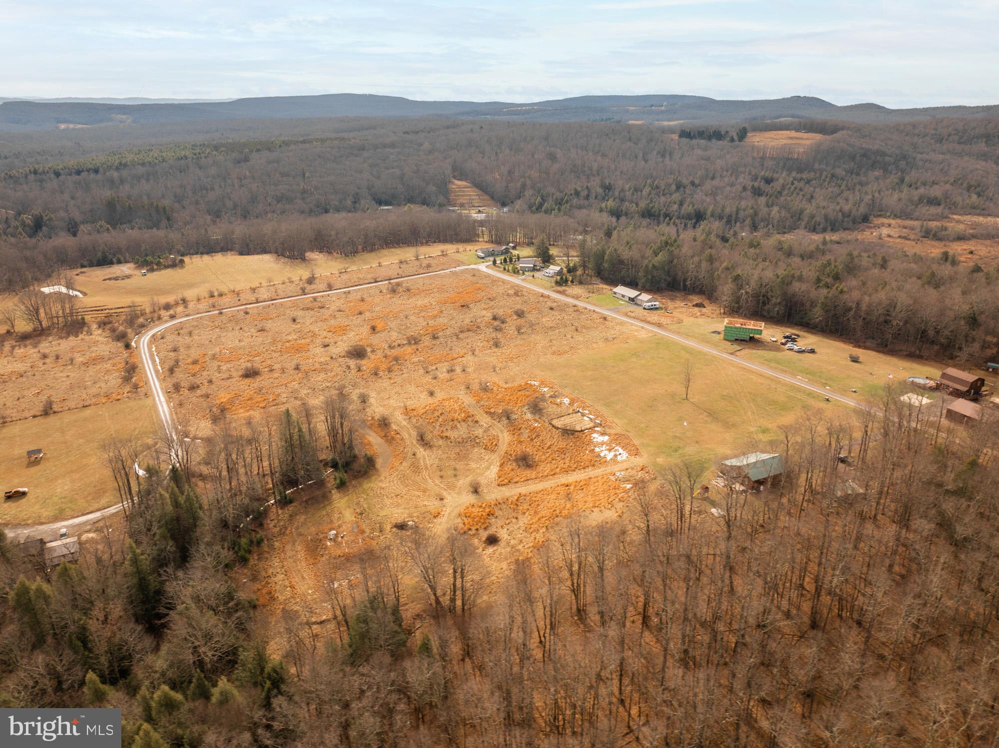 Lot 51 Hemlock Ridge Terra Alta, WV 26764 - Photo 7 of 9 a view of a backyard of a house with a mountain
