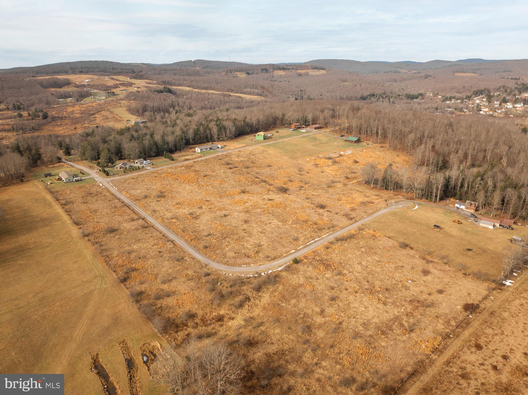 Lot 51 Hemlock Ridge Terra Alta, WV 26764 - Photo 8 of 9 a view of a dry yard with mountains in the background