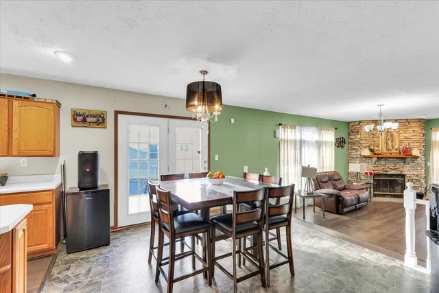 a bathroom with a granite countertop sink and a mirror with toilet