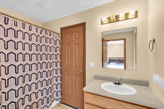 a view of a house with a yard and garage