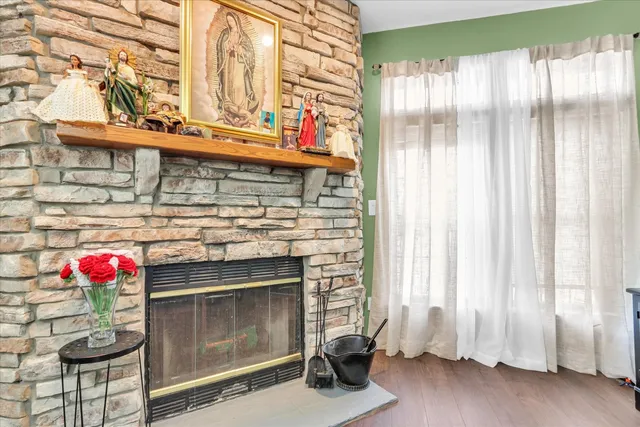 a white house that has a tree in front of it