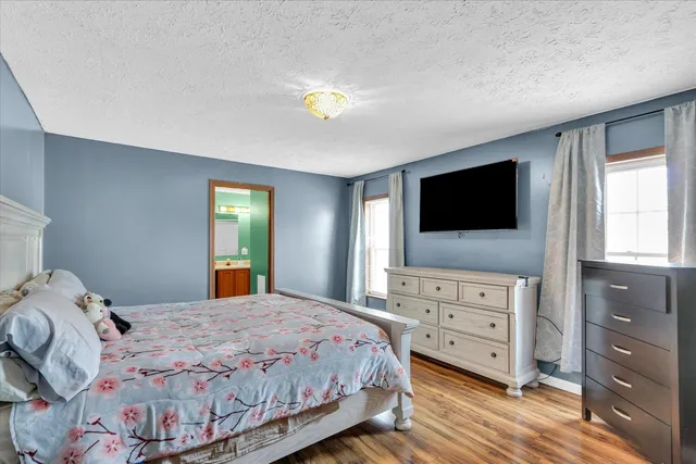 a front view of a house with a large window