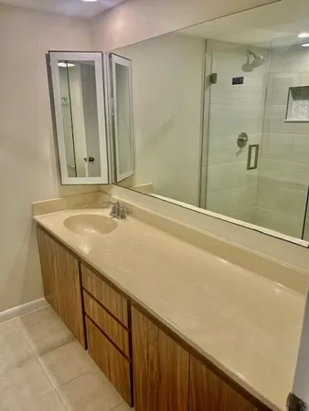 a bathroom with a shower and a toilet