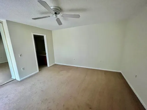 an empty room with a bathroom