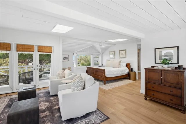 a living room with furniture and large windows