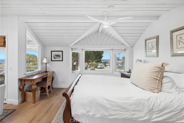 a bed room with a bed and a chair