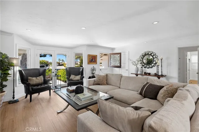 a living room with furniture rug and wooden floor