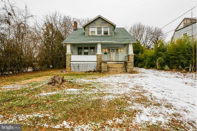8402 Liberty Road Baltimore, MD 21244 - Photo 1 of 26 a front view of a house with a yard