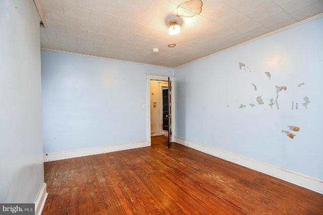 8402 Liberty Road Baltimore, MD 21244 - Photo 11 of 26 wooden floor in a hall with an entryway