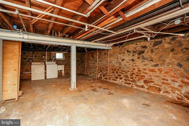 8402 Liberty Road Baltimore, MD 21244 - Photo 12 of 26 a view of a room with wooden walls