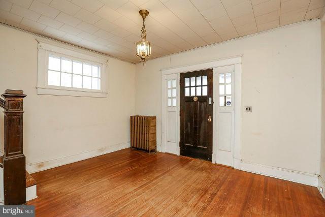 8402 Liberty Road Baltimore, MD 21244 - Photo 16 of 26 a view of a room with window and hardwood