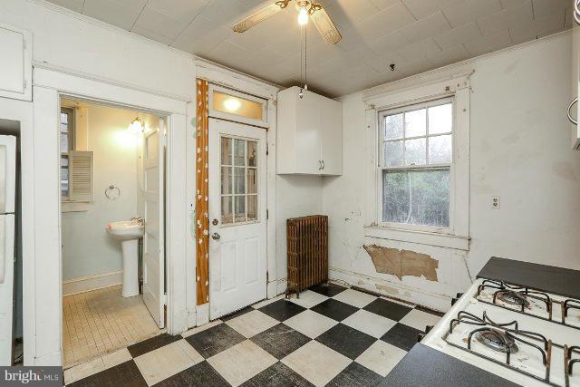 8402 Liberty Road Baltimore, MD 21244 - Photo 23 of 26 a spacious bathroom with a sink a mirror and a shower