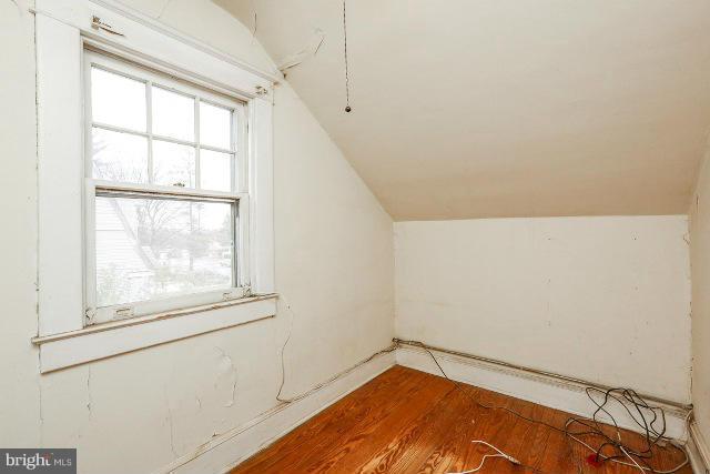 8402 Liberty Road Baltimore, MD 21244 - Photo 6 of 26 a view of empty room with wooden floor and fan