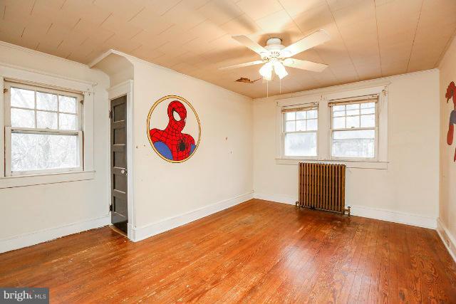 8402 Liberty Road Baltimore, MD 21244 - Photo 8 of 26 an empty room with fan and windows