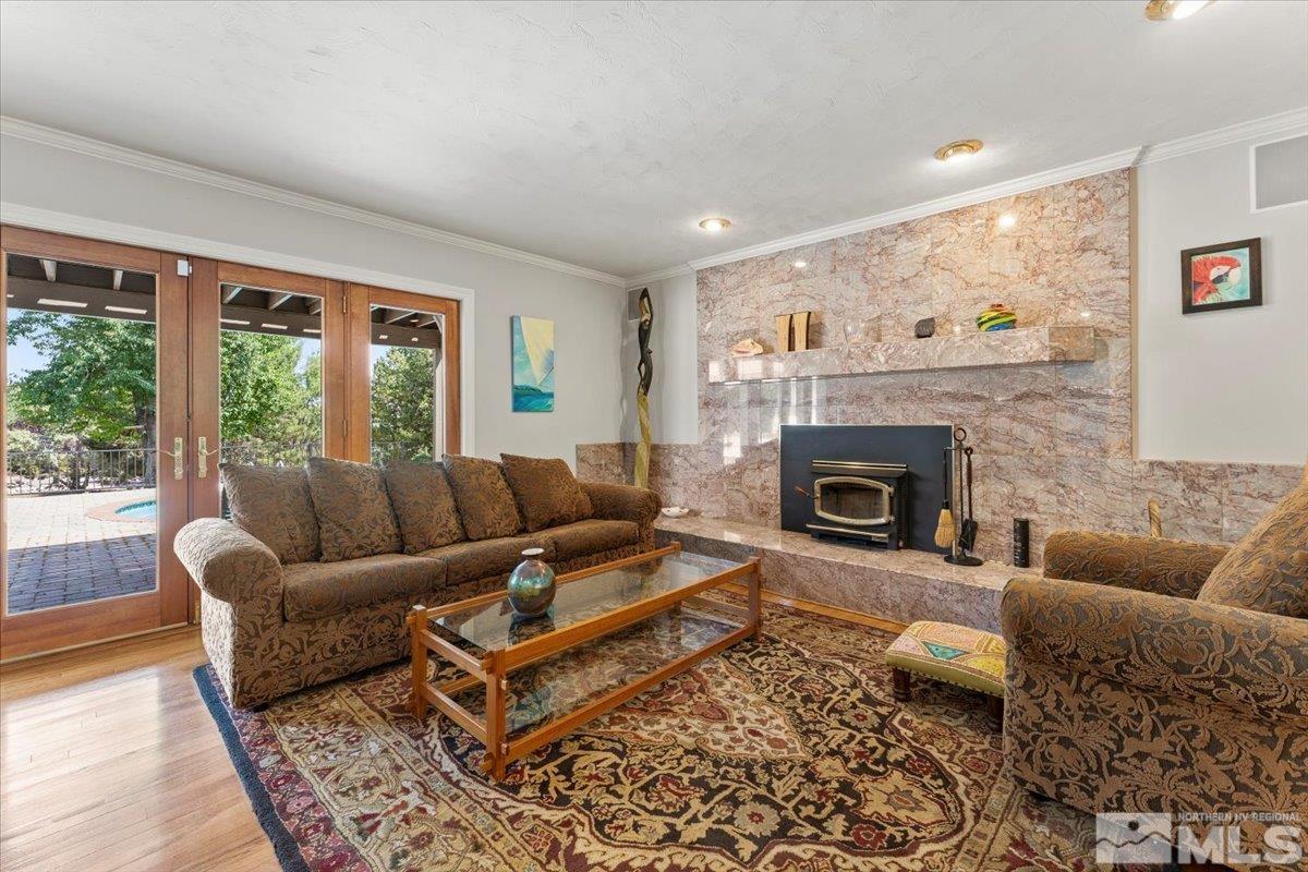4335 Bridle Way Reno, NV 89519 - Photo 6 of 40 a living room with furniture and a fireplace