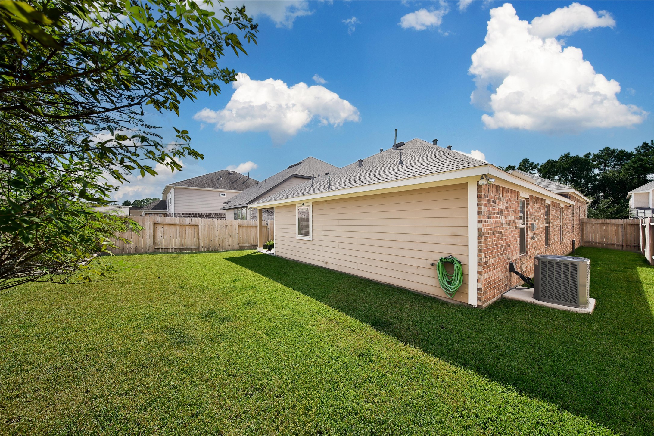 214 Pleasant Hill Way Conroe, TX 77304 - Photo 32 of 43 A sprinkler system keeps your lawn easy to maintain.