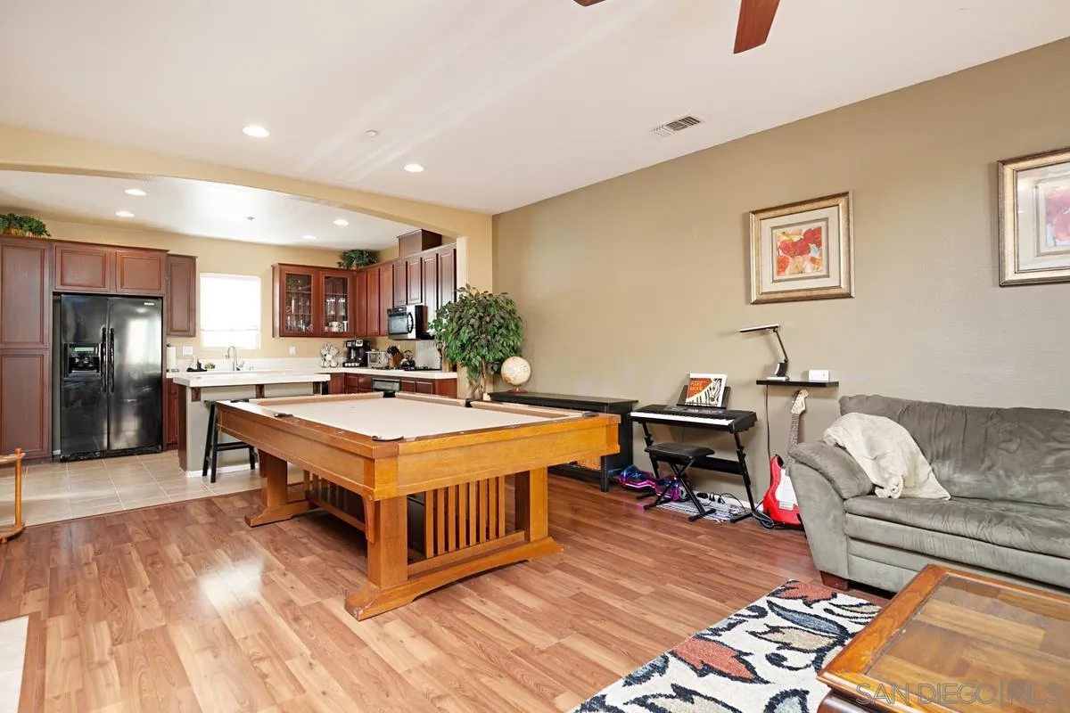 2248 Huntington Point Road, Unit 80 Chula Vista, CA 91914 - Photo 11 of 31 a living room with stainless steel appliances furniture and a kitchen view