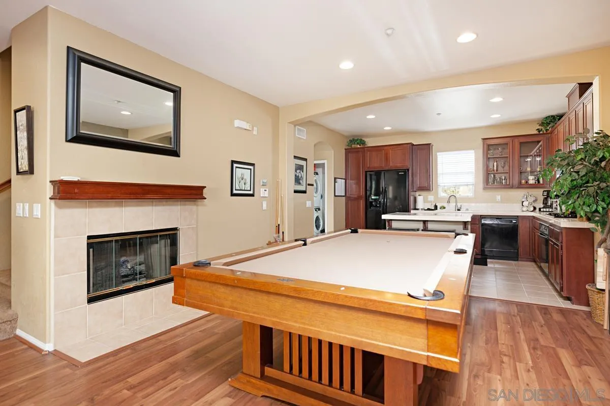 2248 Huntington Point Road, Unit 80 Chula Vista, CA 91914 - Photo 12 of 31 a living room with stainless steel appliances kitchen island a table and a fireplace